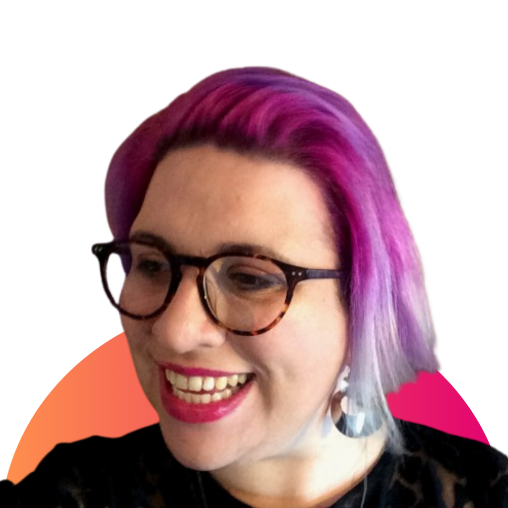 Headshot of a person with colourful purple and pink short hair, wearing glasses with thick brown frame and print pink lipstick is smiling looking toward bottom left-corner. Behind them is a pink and orange semi-cricle.