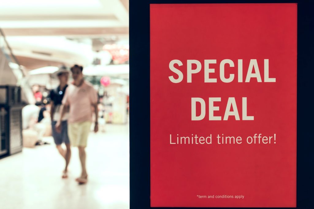 A red sign in a shopping centre that says 'Special Deal Limited time offer only.'